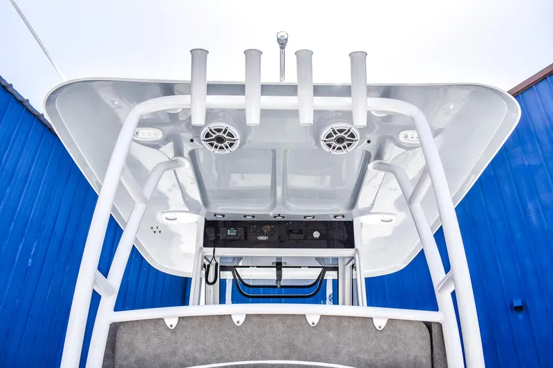  Yacht Photos Pics 2025 Sea Hunt Gamefish 30 T-top with rod holders and speakers, against a blue background.