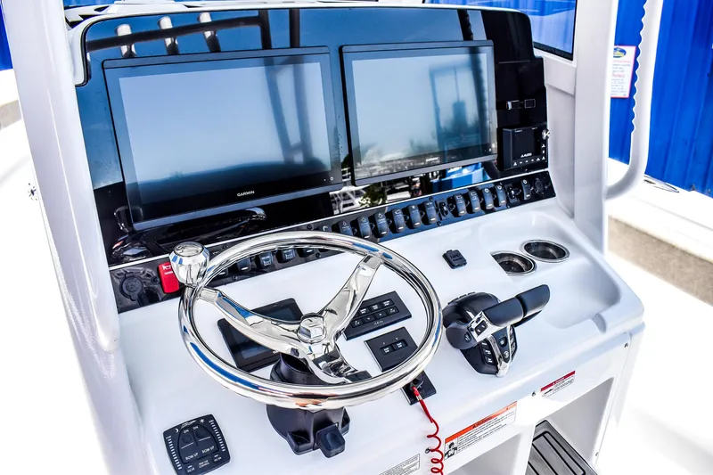  Yacht Photos Pics 2025 Sea Hunt Gamefish 30 dashboard with dual screens and steering wheel.