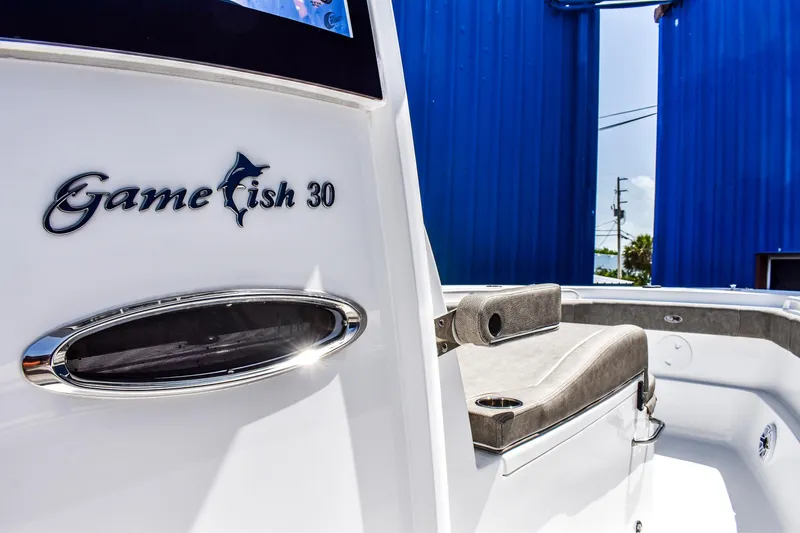  Yacht Photos Pics 2025 Sea Hunt Gamefish 30 boat interior with seating and logo detail.
