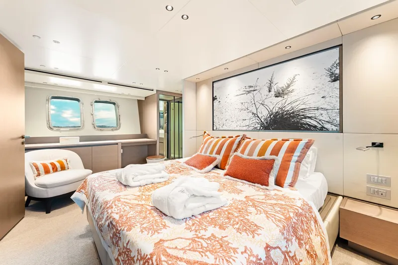 North Yacht Photos Pics Luxurious Sanlorenzo SX88 2020 yacht bedroom with elegant decor and ocean view windows.