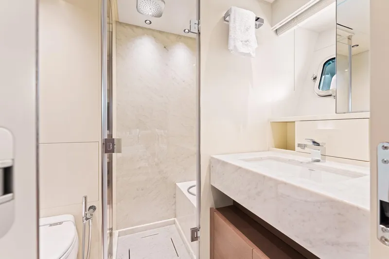 North Yacht Photos Pics Luxurious bathroom in 2020 Sanlorenzo SX88 yacht with marble sink and modern shower.