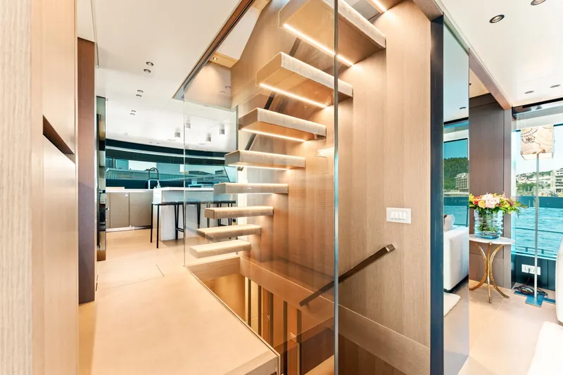 North Yacht Photos Pics Luxurious interior of 2020 Sanlorenzo SX88 yacht with modern staircase and elegant design.