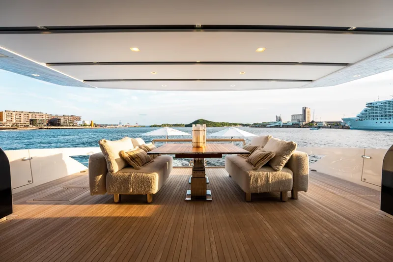 North Yacht Photos Pics Luxurious 2020 Sanlorenzo SX88 yacht deck with elegant seating and scenic waterfront view.