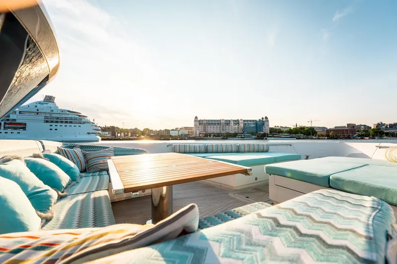 North Yacht Photos Pics Luxurious Sanlorenzo SX88 yacht deck with stylish seating and scenic waterfront view.