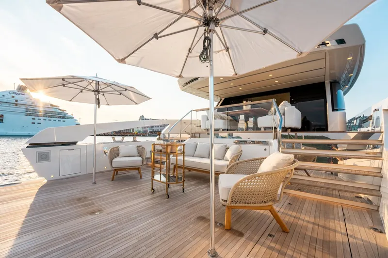 North Yacht Photos Pics Luxurious 2020 Sanlorenzo SX88 yacht deck with seating, umbrellas, and ocean view.