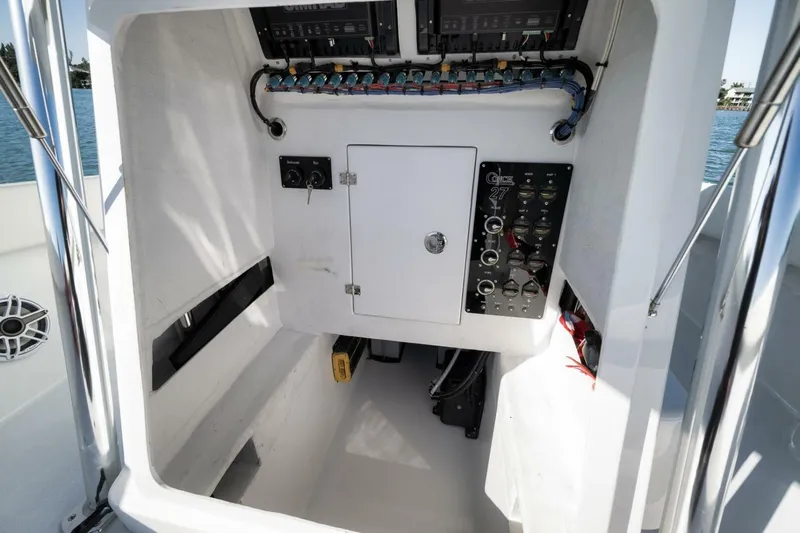  Yacht Photos Pics 2025 Conch 27 boat interior with control panel and wiring.