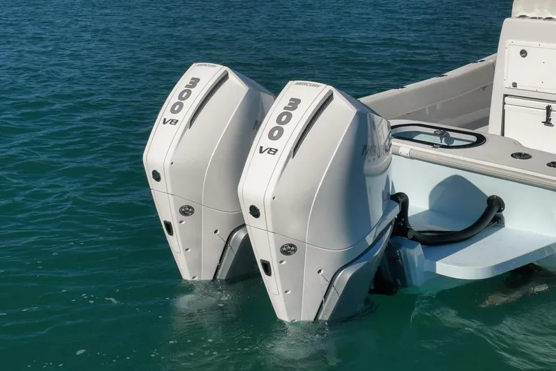  Yacht Photos Pics Twin Mercury 300 V8 engines on a 2025 Conch 27 boat in clear water.