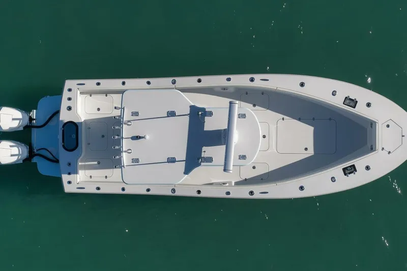  Yacht Photos Pics Overhead view of 2025 Conch 27 boat on clear water.