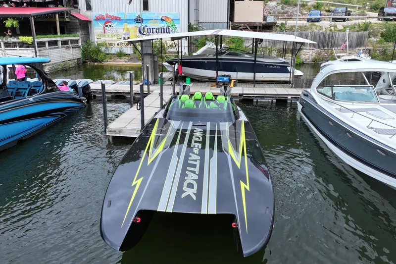 Aoa Marine C4000 Yacht Photos Pics 2025 Mystic Powerboats C4000 docked, featuring sleek design and vibrant green seats.