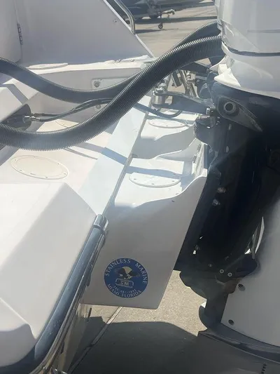  Yacht Photos Pics 2003 Grady-White 306 Bimini boat engine and stern detail in sunlight.