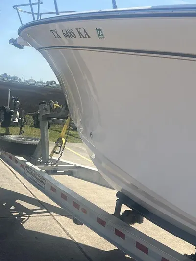  Yacht Photos Pics 2003 Grady-White 306 Bimini boat on trailer, side view, registration TX 6488 KA.