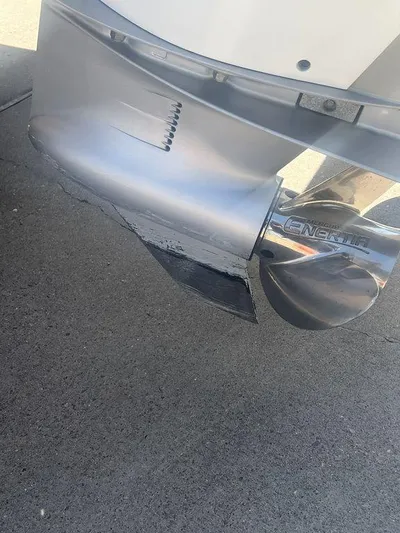  Yacht Photos Pics Close-up of a 2003 Grady-White 306 Bimini boat propeller on pavement.