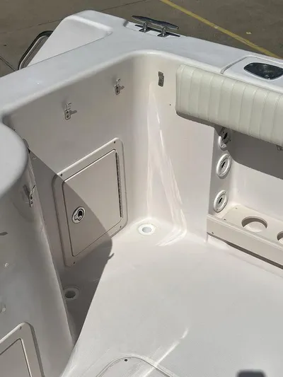  Yacht Photos Pics 2003 Grady-White 306 Bimini boat interior, featuring storage compartments and seating area.