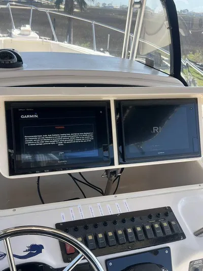  Yacht Photos Pics 2003 Grady-White 306 Bimini boat dashboard with Garmin navigation screens.