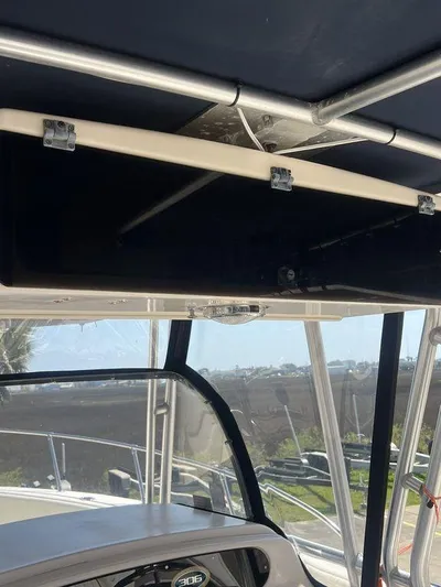  Yacht Photos Pics 2003 Grady-White 306 Bimini boat interior with dashboard and canopy view.