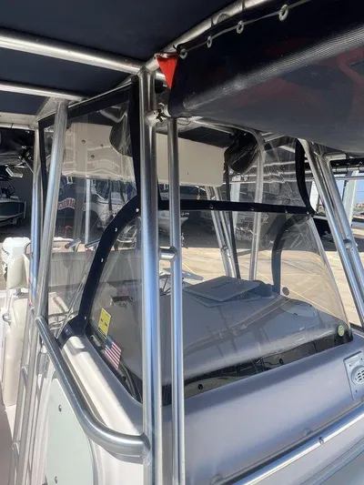  Yacht Photos Pics 2003 Grady-White 306 Bimini boat with stainless steel frame and clear enclosure.