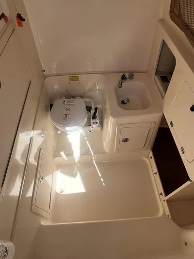  Yacht Photos Pics 2003 Grady-White 306 Bimini boat interior with sink and toilet.