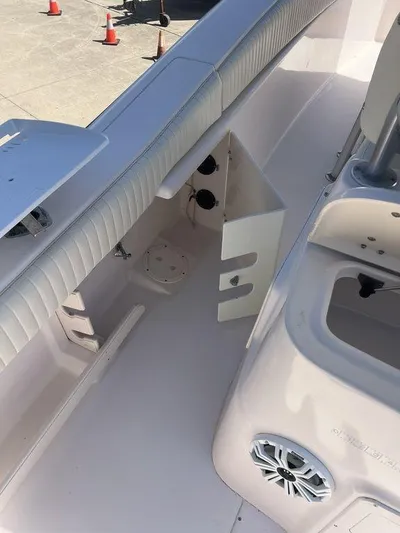  Yacht Photos Pics 2003 Grady-White 306 Bimini boat interior with seating and storage compartments.