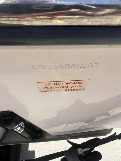  Yacht Photos Pics 2003 Grady-White 306 Bimini boat with safety warning label and hull identification number.