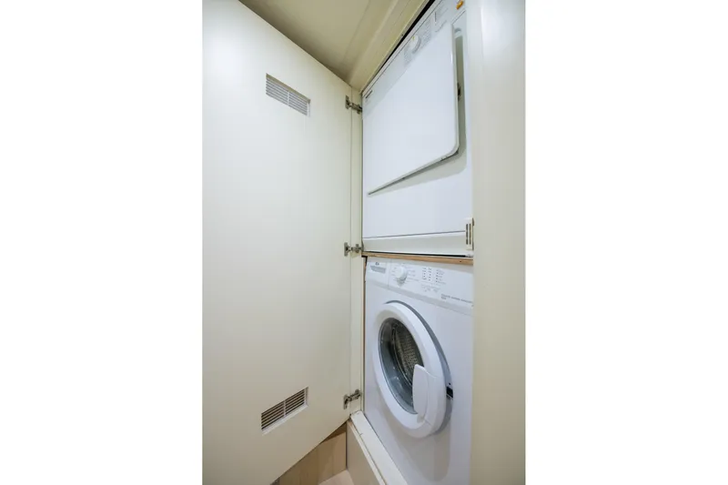 La Rubia Yacht Photos Pics Stacked washer and dryer in Azimut La Rubia 2011 yacht laundry area.