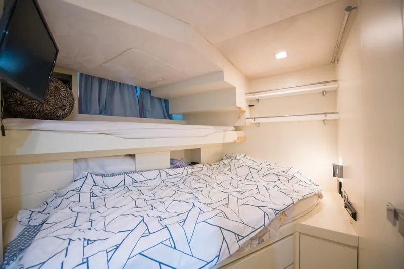 La Rubia Yacht Photos Pics Cozy bedroom interior on 2011 Azimut La Rubia yacht with modern bedding and lighting.