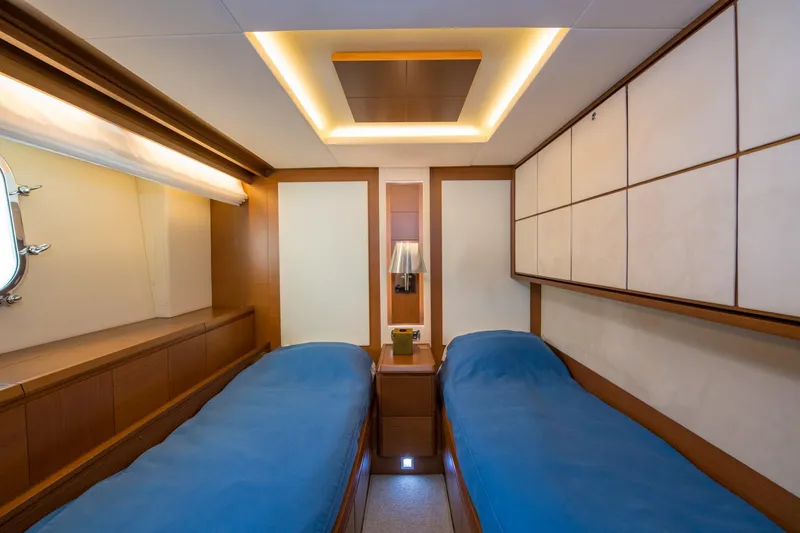 La Rubia Yacht Photos Pics Luxurious twin cabin interior on 2011 Azimut La Rubia yacht, featuring elegant wood paneling.