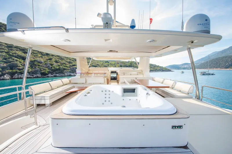 La Rubia Yacht Photos Pics Luxurious 2011 Azimut La Rubia yacht deck with jacuzzi, surrounded by scenic ocean views.