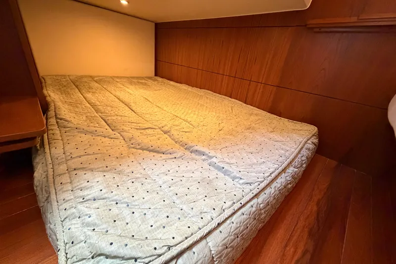 Loophole Yacht Photos Pics Cozy cabin bed in 2013 Tiara Yachts 3600 Coronet with wooden interior.