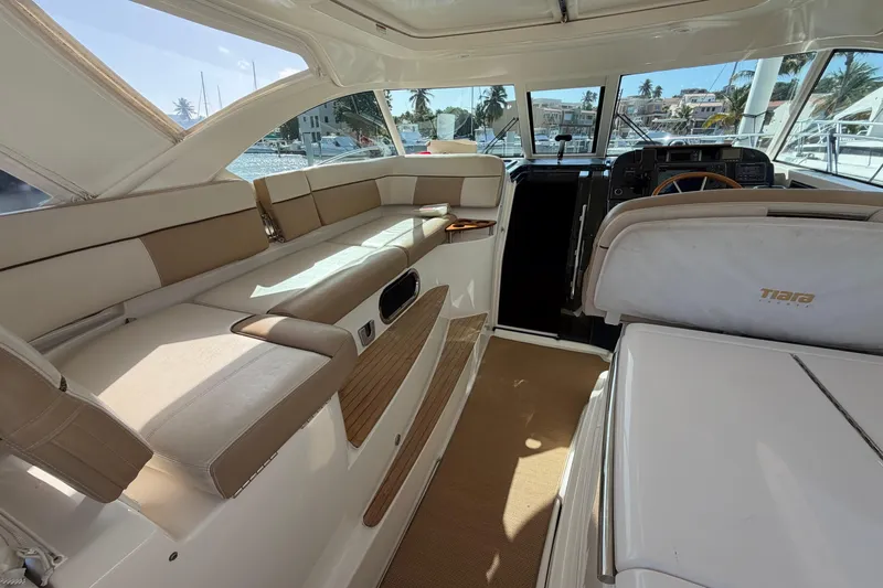 Loophole Yacht Photos Pics Interior of 2013 Tiara Yachts 3600 Coronet, featuring beige seating and helm station.