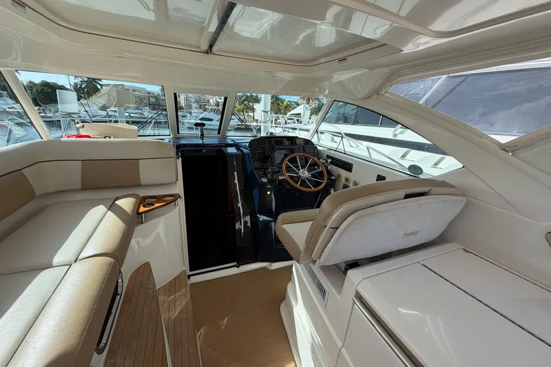 Loophole Yacht Photos Pics Interior of 2013 Tiara Yachts 3600 Coronet, featuring helm and seating area.