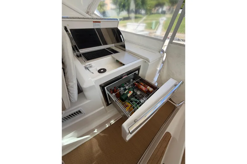 Loophole Yacht Photos Pics 2013 Tiara Yachts 3600 Coronet with open beverage cooler and grill on deck.