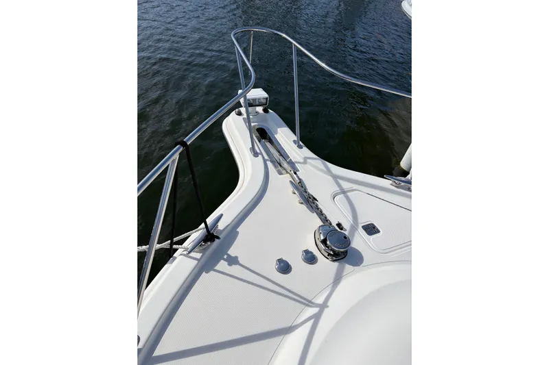 Loophole Yacht Photos Pics 2013 Tiara Yachts 3600 Coronet bow with anchor chain and railing on water.