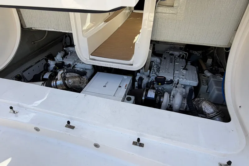 Loophole Yacht Photos Pics Engine compartment of 2013 Tiara Yachts 3600 Coronet, showcasing dual engines and mechanical components.