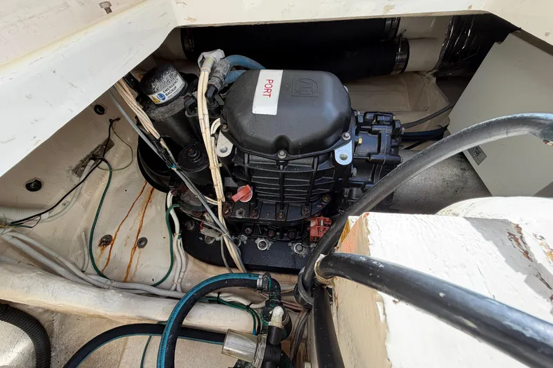Loophole Yacht Photos Pics Engine compartment of 2013 Tiara Yachts 3600 Coronet, showcasing mechanical components and wiring.