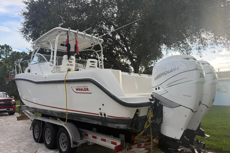  Yacht Photos Pics 2011 Boston Whaler 285 Conquest boat on trailer with dual Mercury engines.