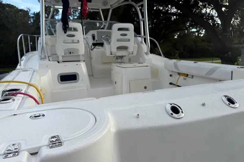  Yacht Photos Pics 2011 Boston Whaler 285 Conquest boat interior with seating and control panel.