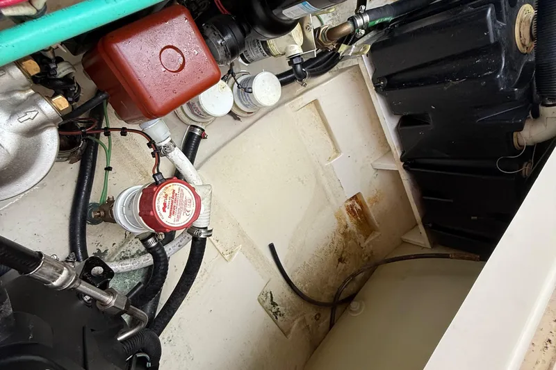  Yacht Photos Pics Engine compartment of a 2011 Boston Whaler 285 Conquest boat, showing various components and wiring.