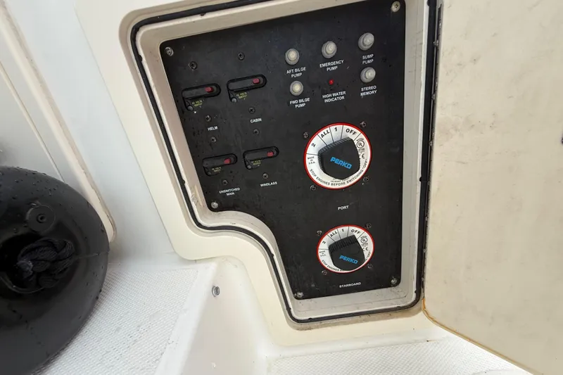  Yacht Photos Pics Control panel of a 2011 Boston Whaler 285 Conquest boat, featuring switches and dials.