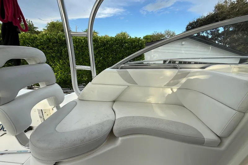  Yacht Photos Pics 2011 Boston Whaler 285 Conquest boat interior with white cushioned seating.