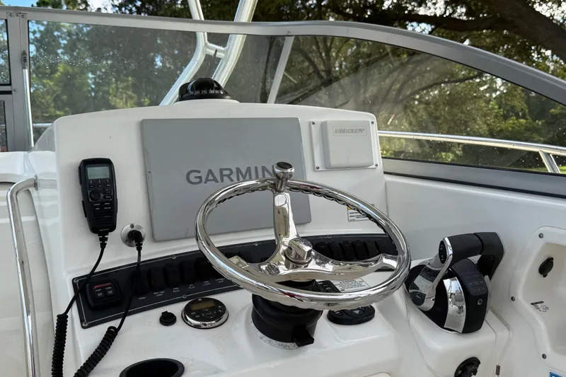  Yacht Photos Pics 2011 Boston Whaler 285 Conquest helm with Garmin navigation and Mercury controls.