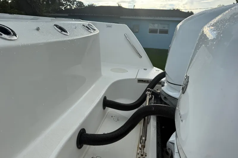  Yacht Photos Pics 2011 Boston Whaler 285 Conquest boat deck with dual outboard motors.