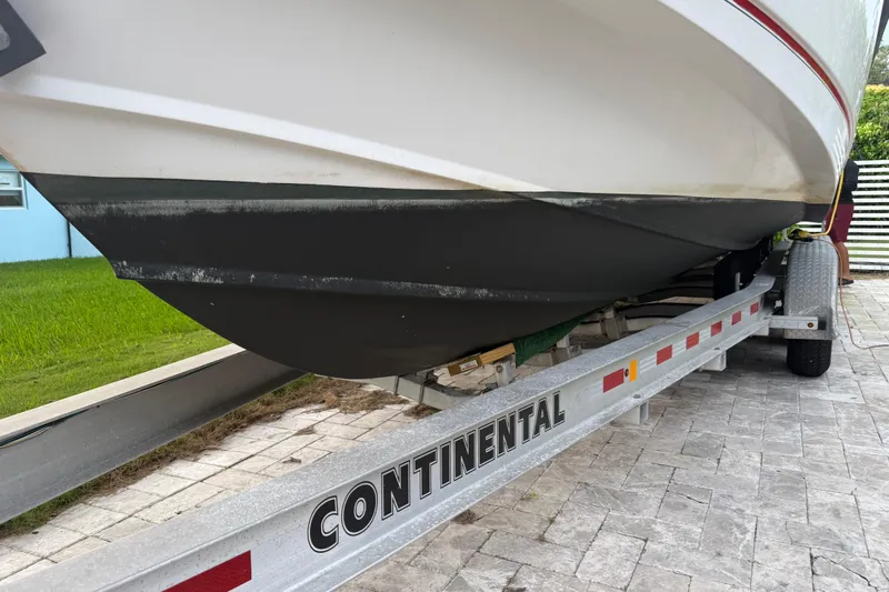  Yacht Photos Pics 2011 Boston Whaler 285 Conquest boat on Continental trailer, parked on paved driveway.