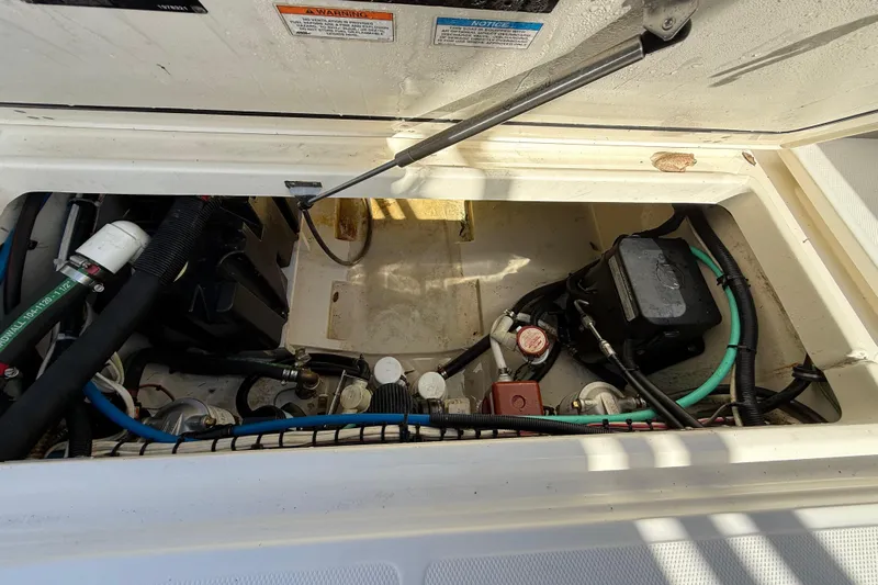  Yacht Photos Pics Engine compartment of a 2011 Boston Whaler 285 Conquest, showing various mechanical components.