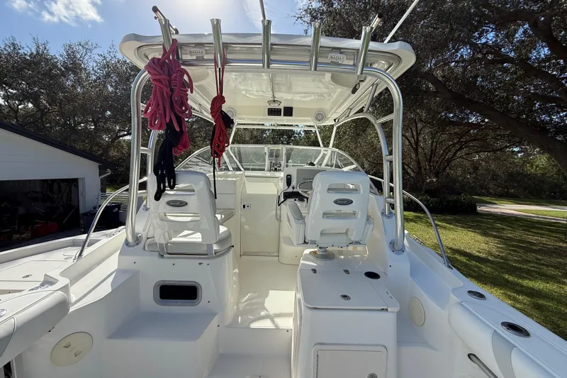  Yacht Photos Pics 2011 Boston Whaler 285 Conquest boat interior with seating and equipment.