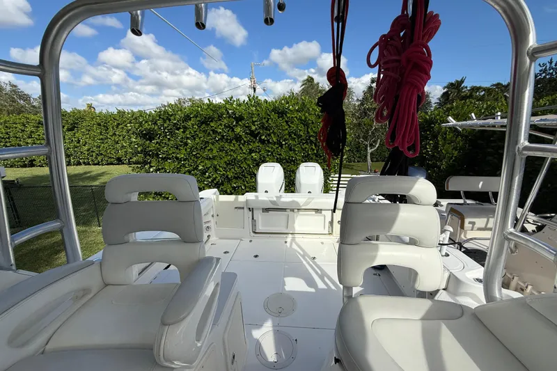  Yacht Photos Pics 2011 Boston Whaler 285 Conquest boat interior with seating and equipment.