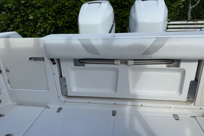  Yacht Photos Pics 2011 Boston Whaler 285 Conquest boat interior with dual engines and seating area.