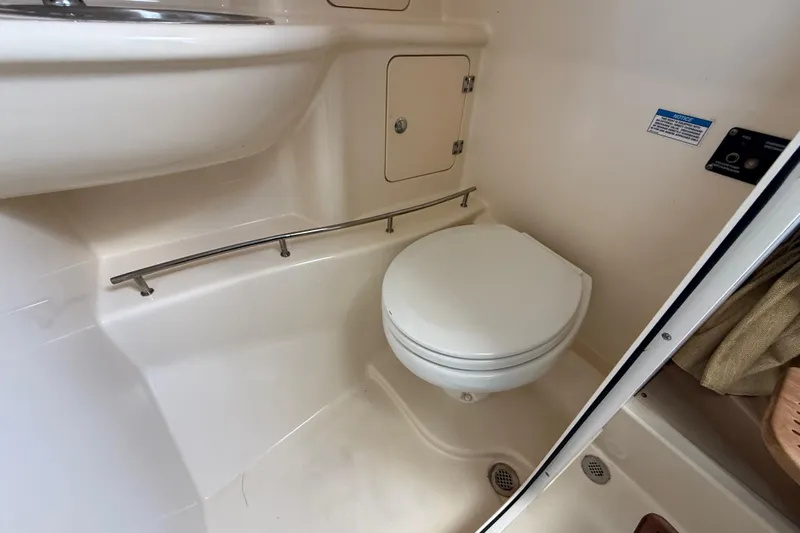  Yacht Photos Pics 2011 Boston Whaler 285 Conquest boat bathroom with toilet and sink.
