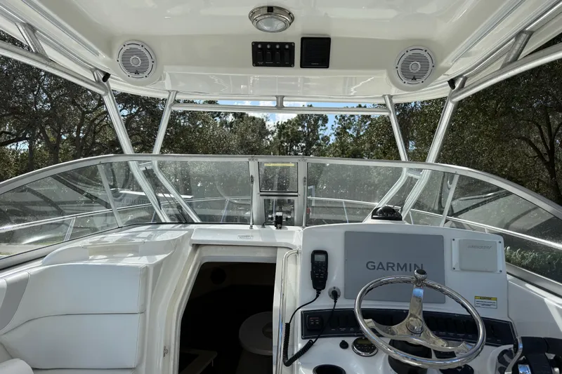  Yacht Photos Pics Interior view of 2011 Boston Whaler 285 Conquest boat cockpit with Garmin navigation.