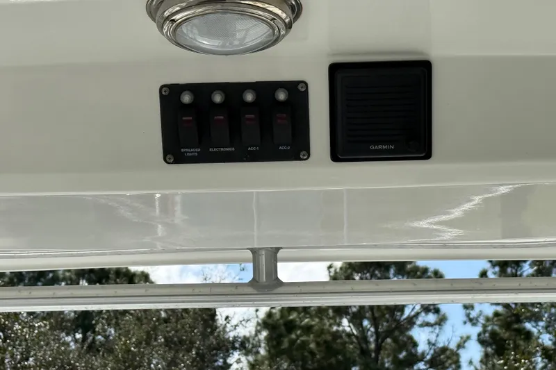  Yacht Photos Pics 2011 Boston Whaler 285 Conquest dashboard with switches and Garmin device.