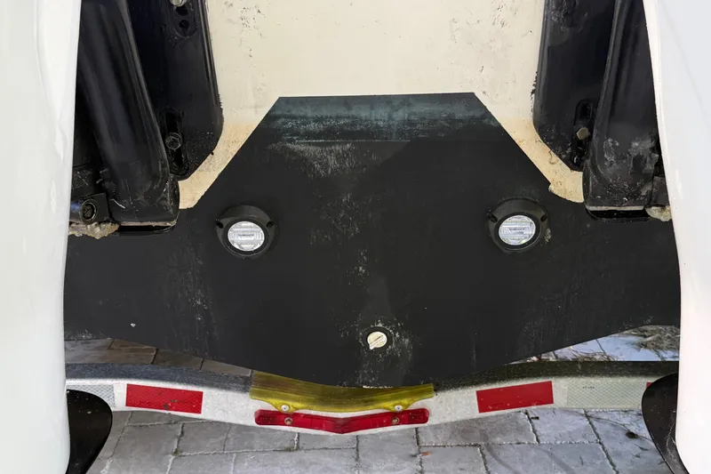  Yacht Photos Pics 2011 Boston Whaler 285 Conquest boat transom with trailer, showing underwater lights.